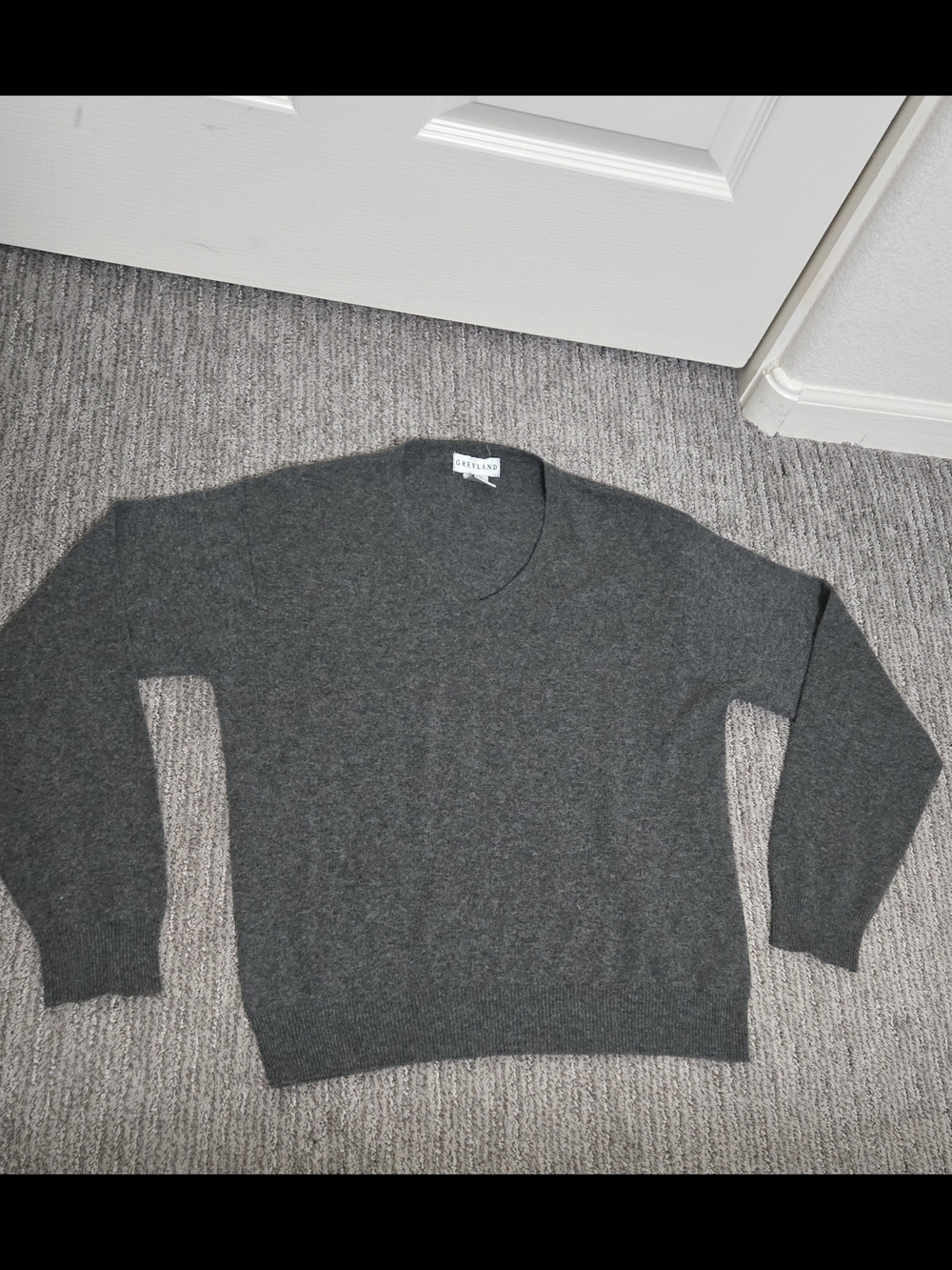 100% cashmere sweater in a women's medium. Greyland. Dark gray, v-neck.